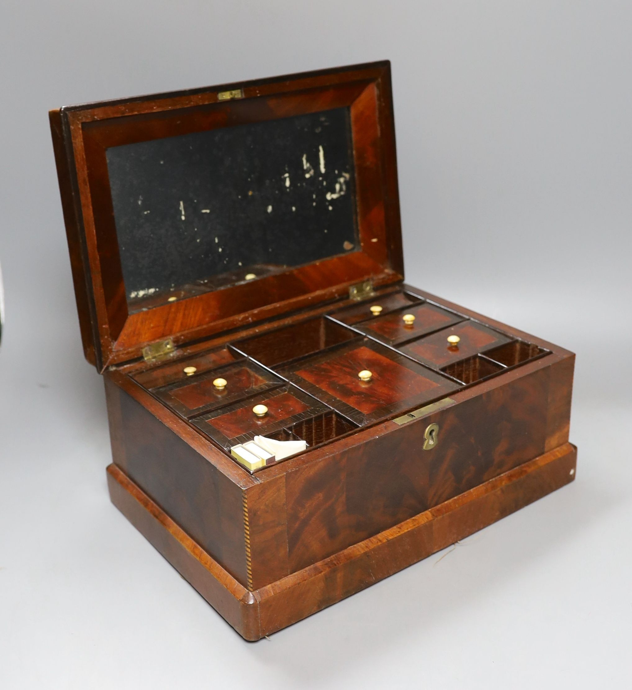 A 19th century Continental mahogany vanity case - 14.5cm tall